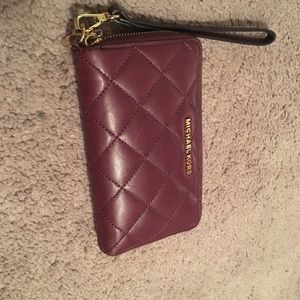 MK maroon wristlet.